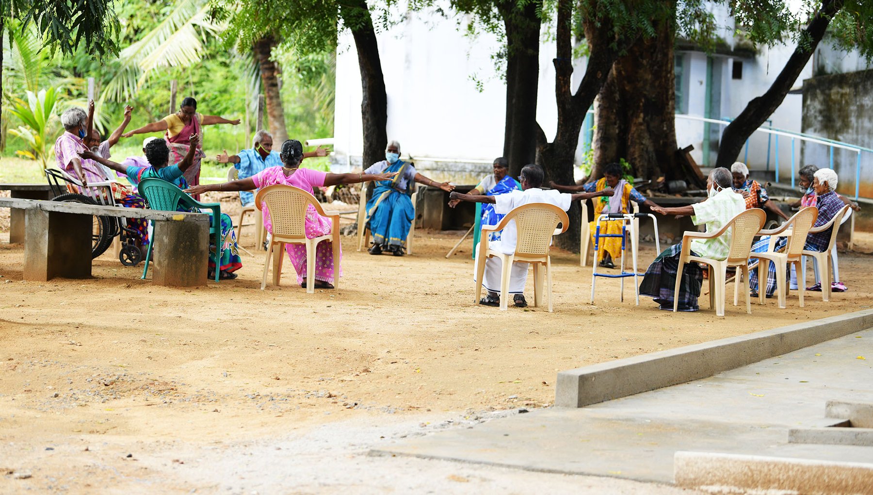 Residents spending time together under the trees